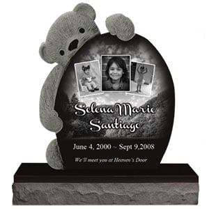 Black monument with teddy bear